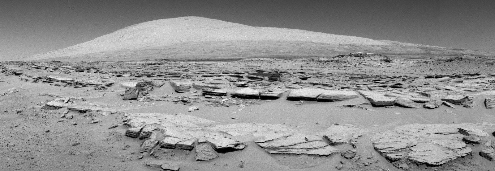 A black and white photo of the surface of Mars.