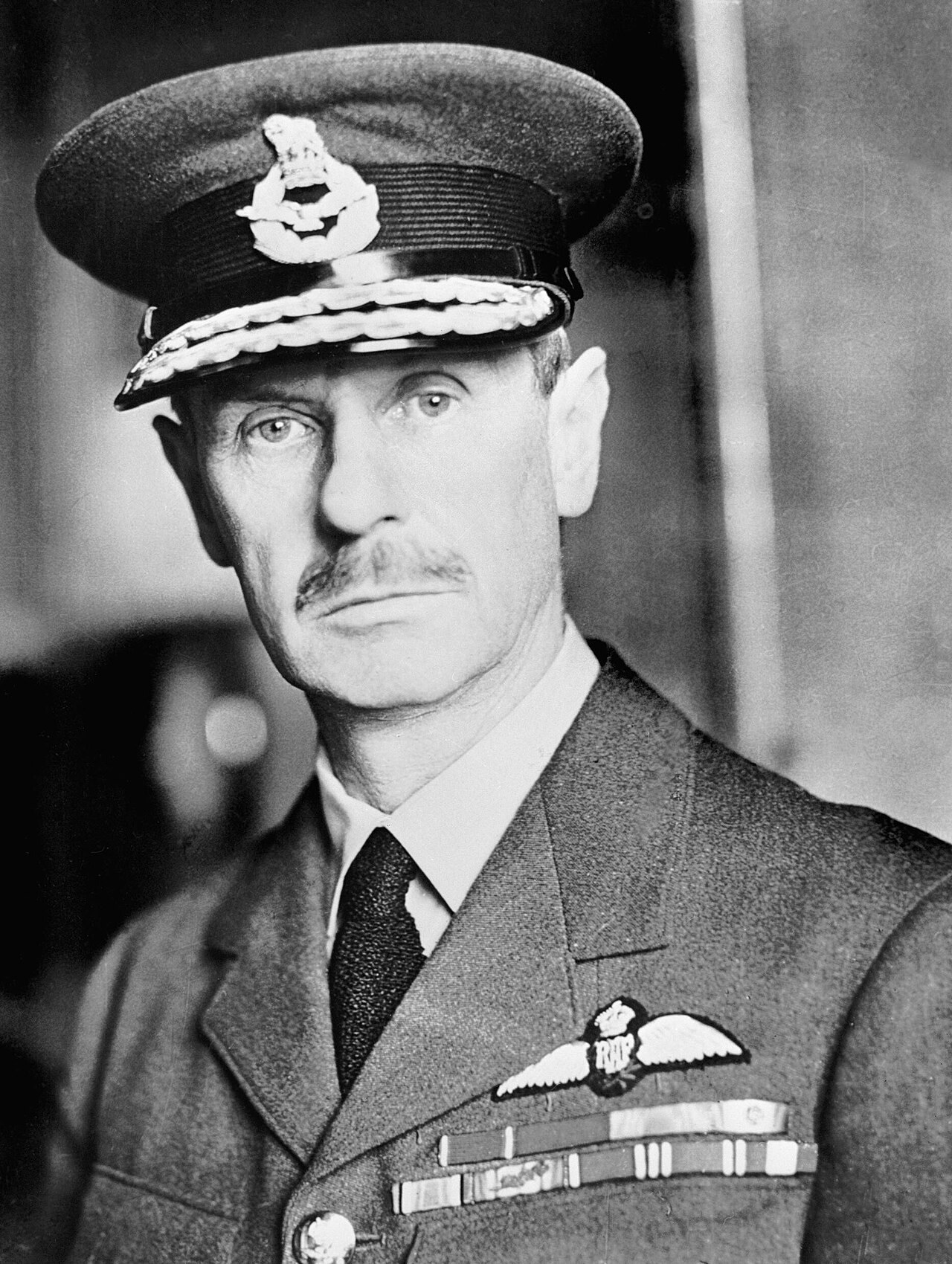 Formal portrait of a senior RAF officer in uniform with medal ribbons