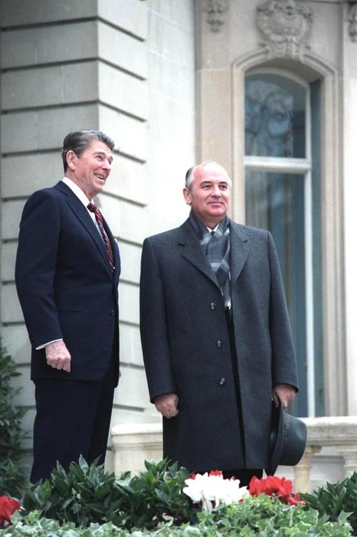 Reagan in a suit and Gorbachev in a heavy overcoat standing together outside the Villa Fleur d'Eau at their first meeting in 1985