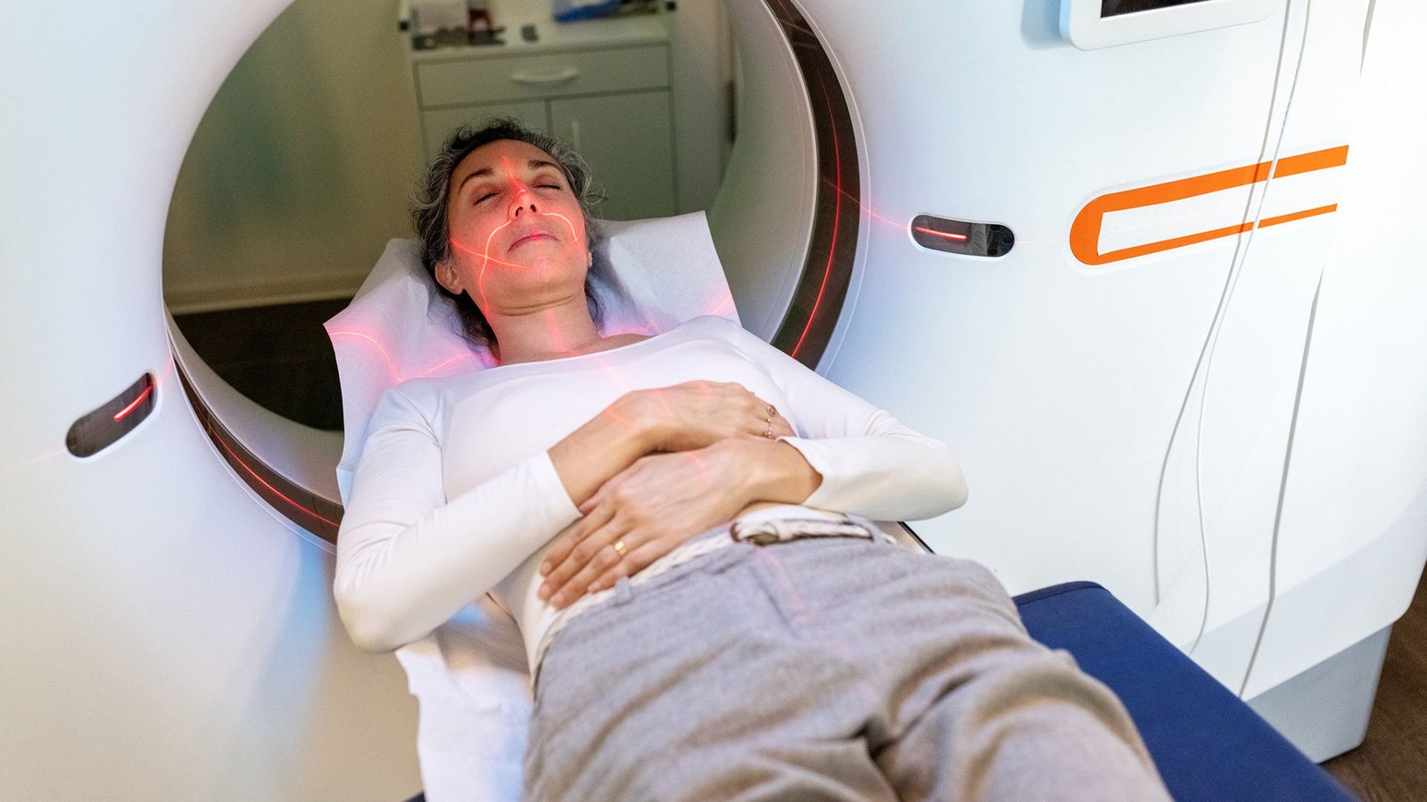 A woman lays inside an MRI machine