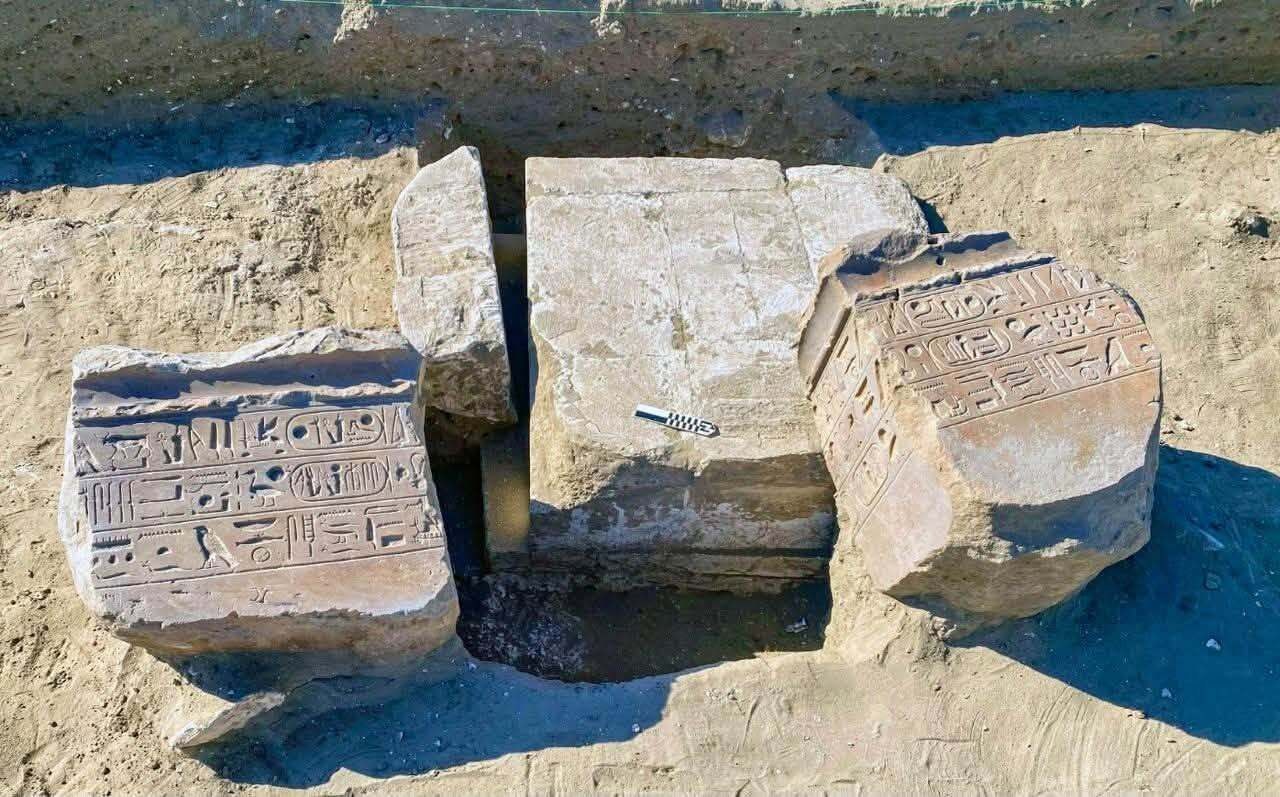 A close up of stone artifacts with writing on them