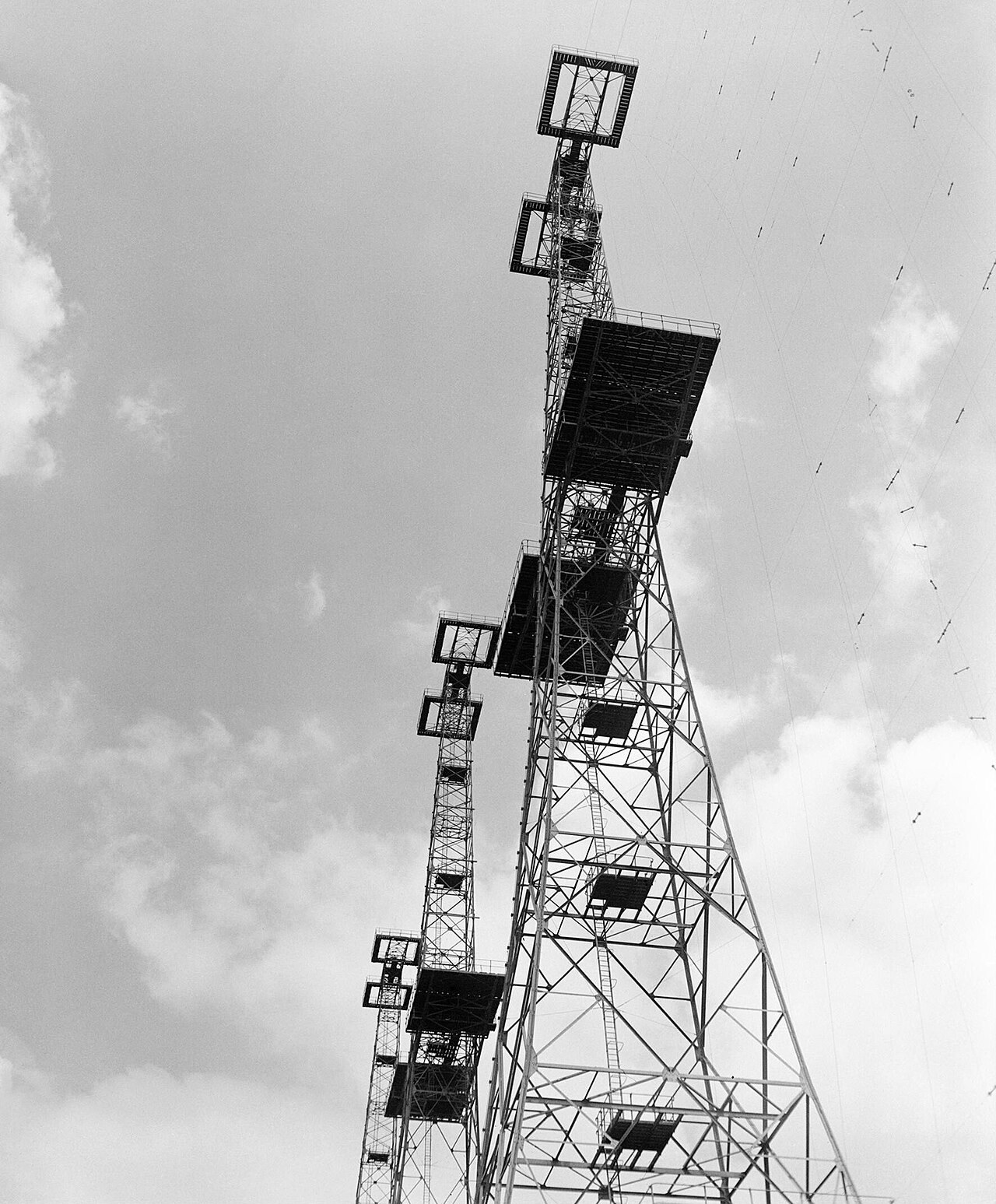A tall steel lattice radar transmitter tower against the sky