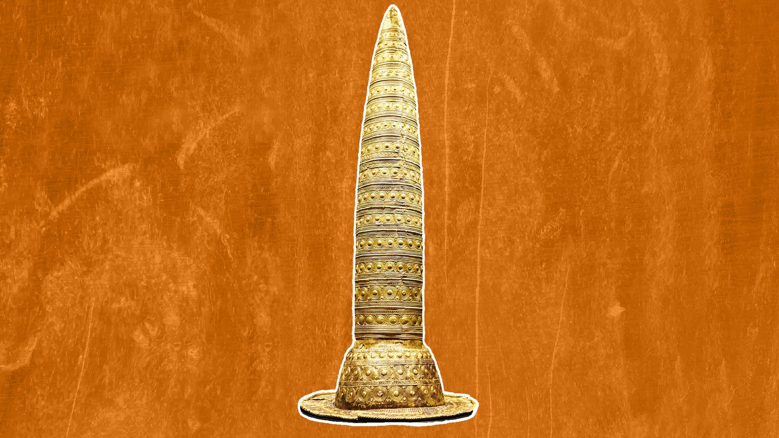 a pointy gold hat against an orange background