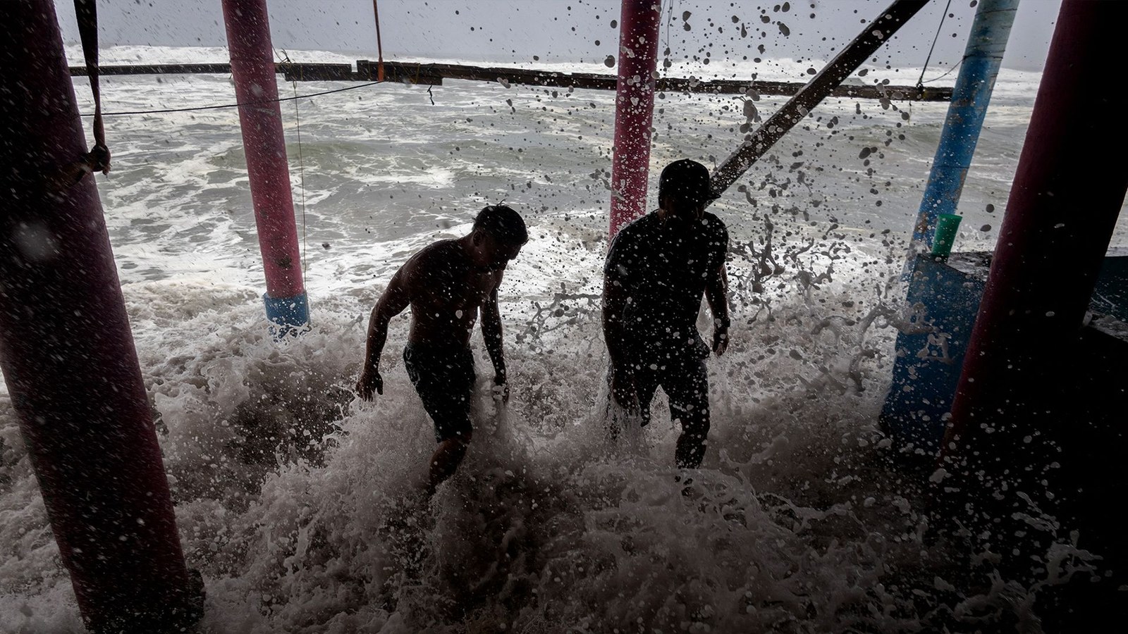 Residents in Playa Azul, Mexico used sandbags as a protective barrier against strong waves generated by Hurricane Polo.