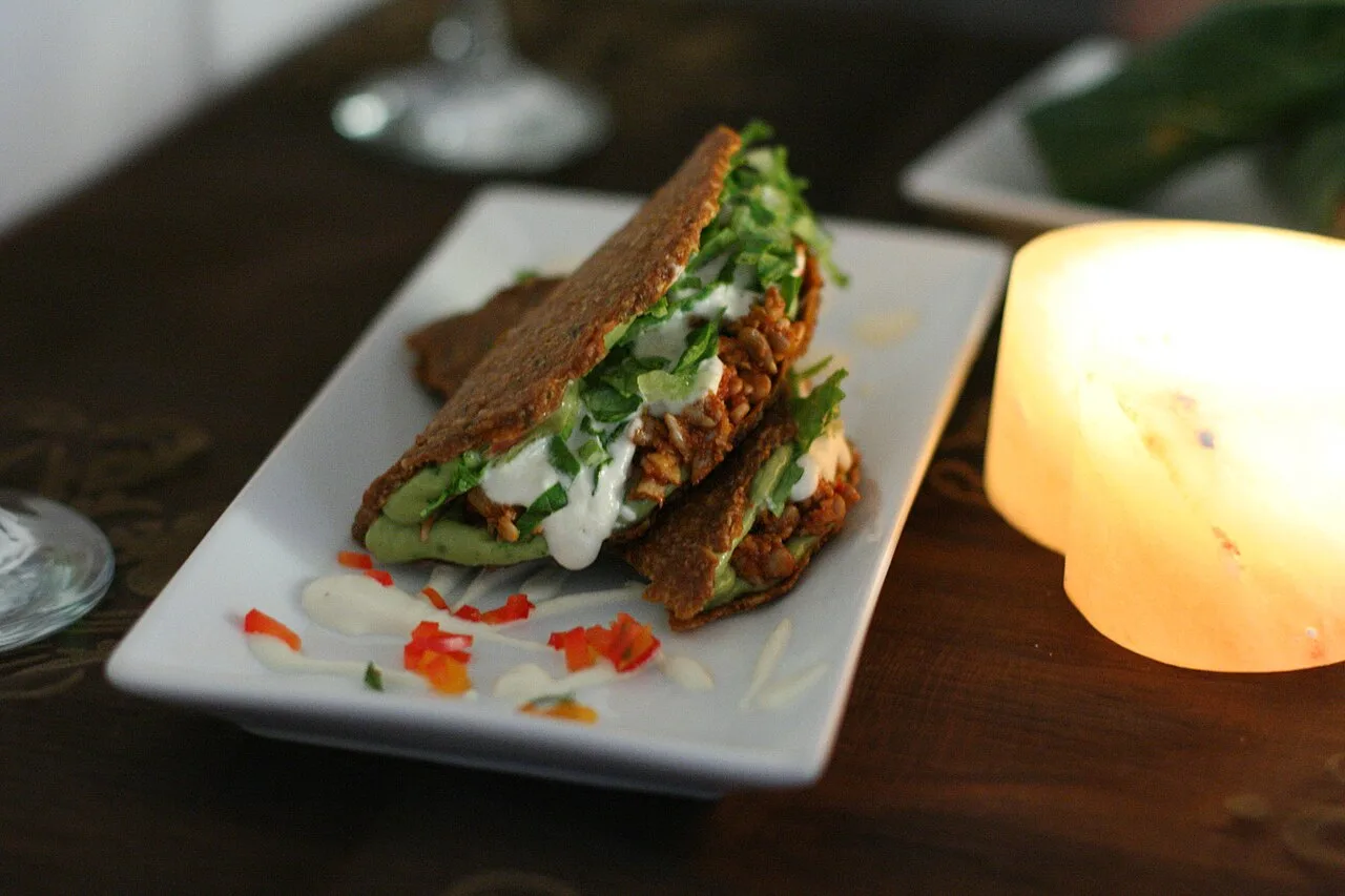 Raw food tacos prepared with guacamole, non-fried beans and sour cream. Raw foodism promotes the consumption of food which has not been cooked.