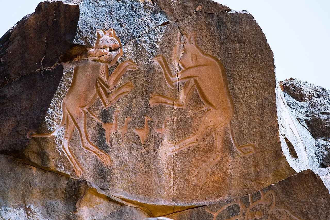 Rock carving known as Meerkatze (named by archaeologist Leo Frobenius), rampant lionesses in Wadi Mathendous, Mesak Settafet region of Libya.
