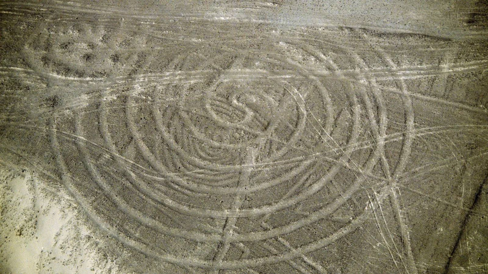 A star shape with circles in it is seen from above.