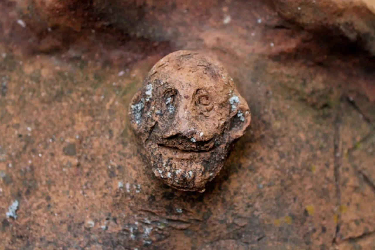 Unique Silenos face found on Roman-era clay coffin at Attouda, Turkey