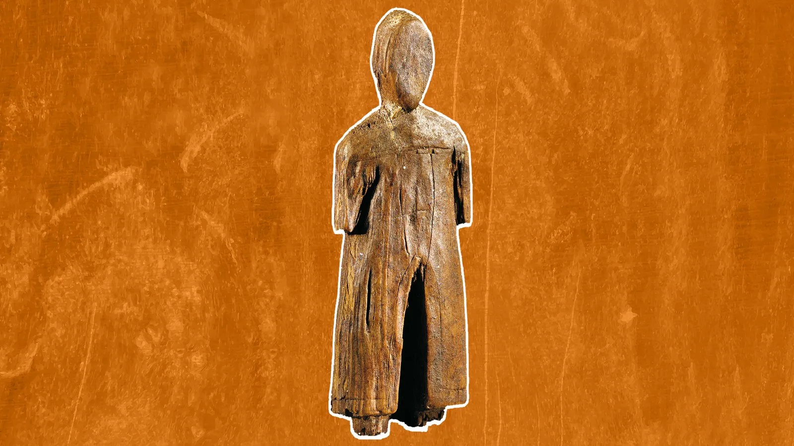 a wooden human figurine on an orange background