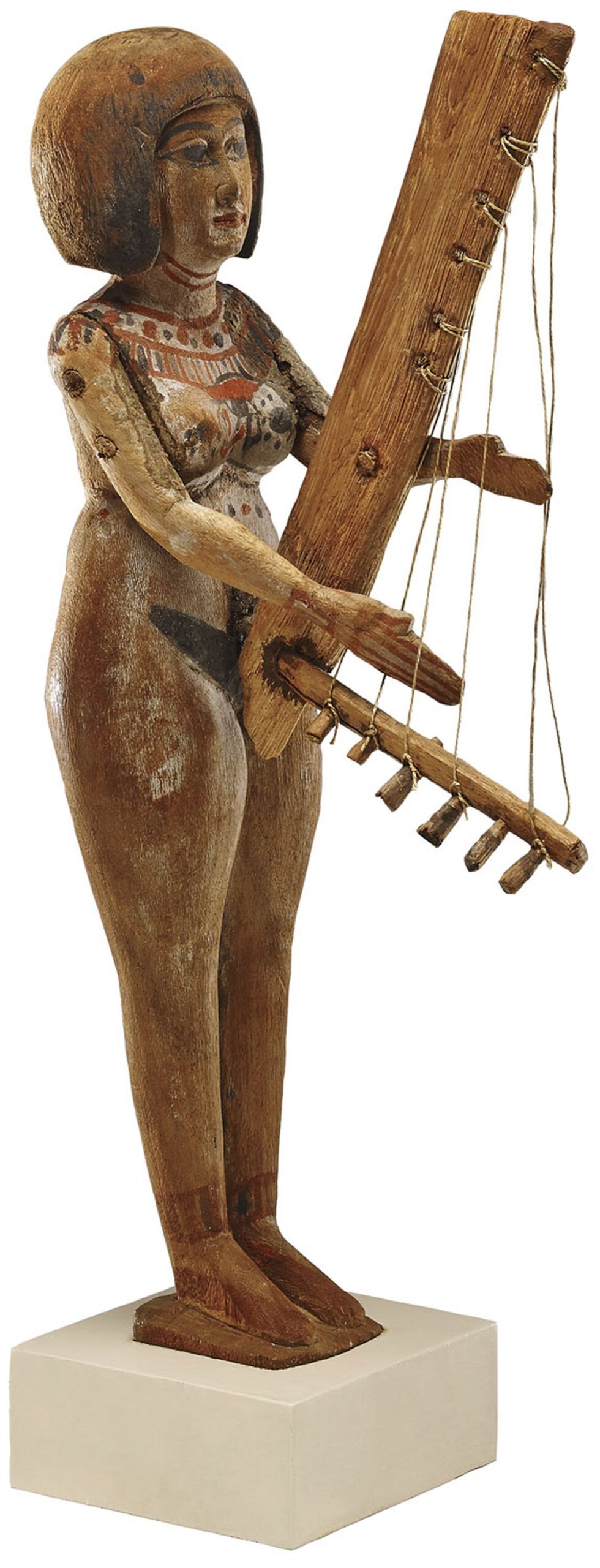 Wooden figurine of a woman playing an angular harp